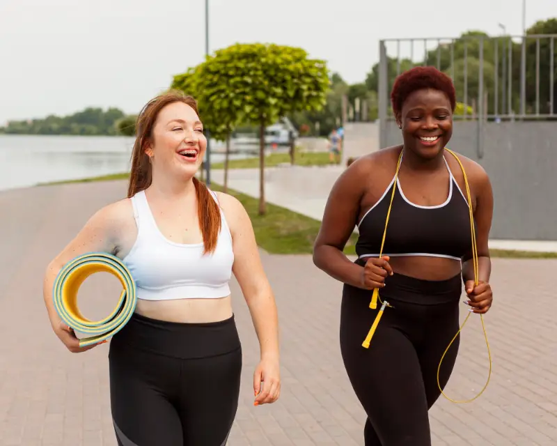Female friends outdoors trying to exercise